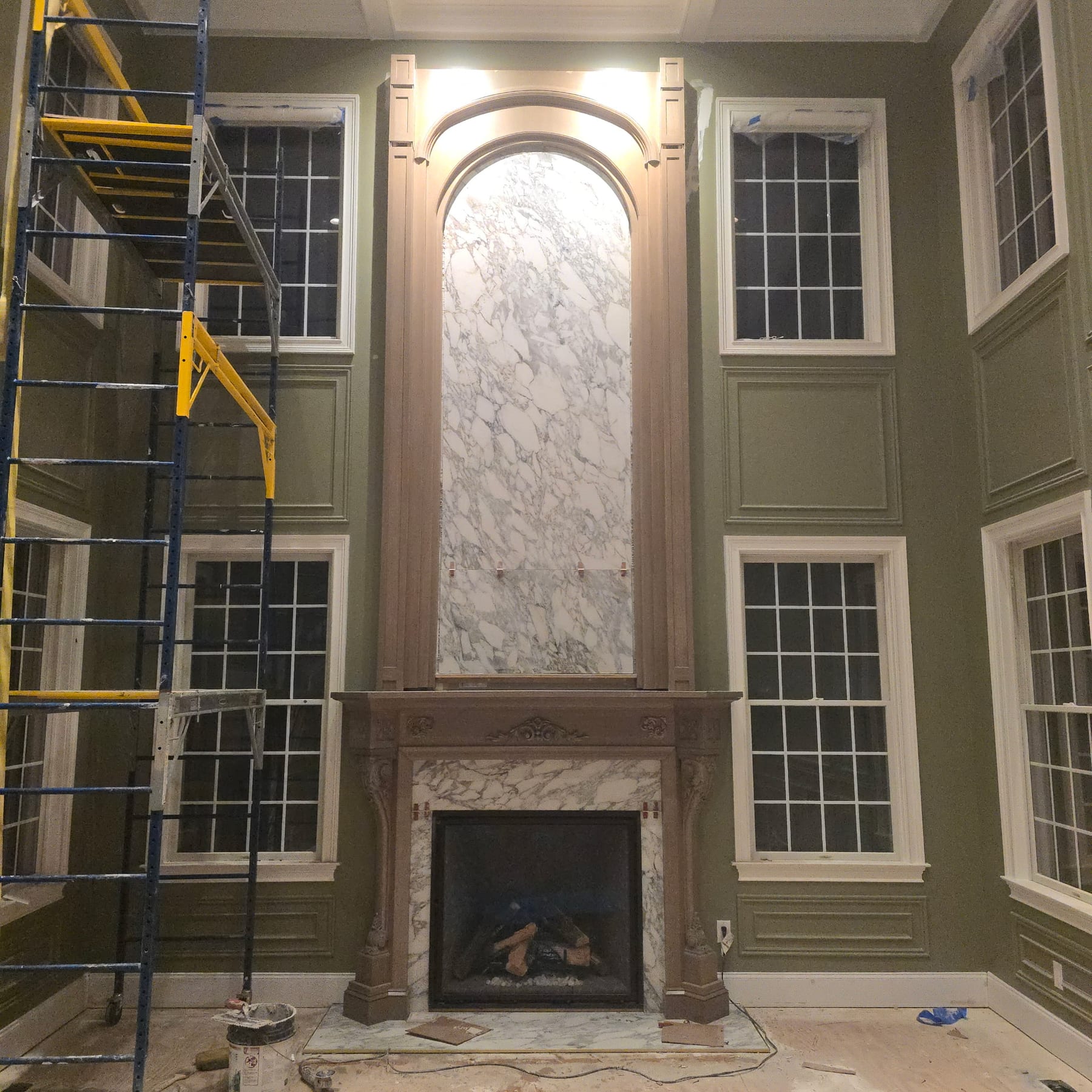 Custom wood mantel and marble fireplace surround