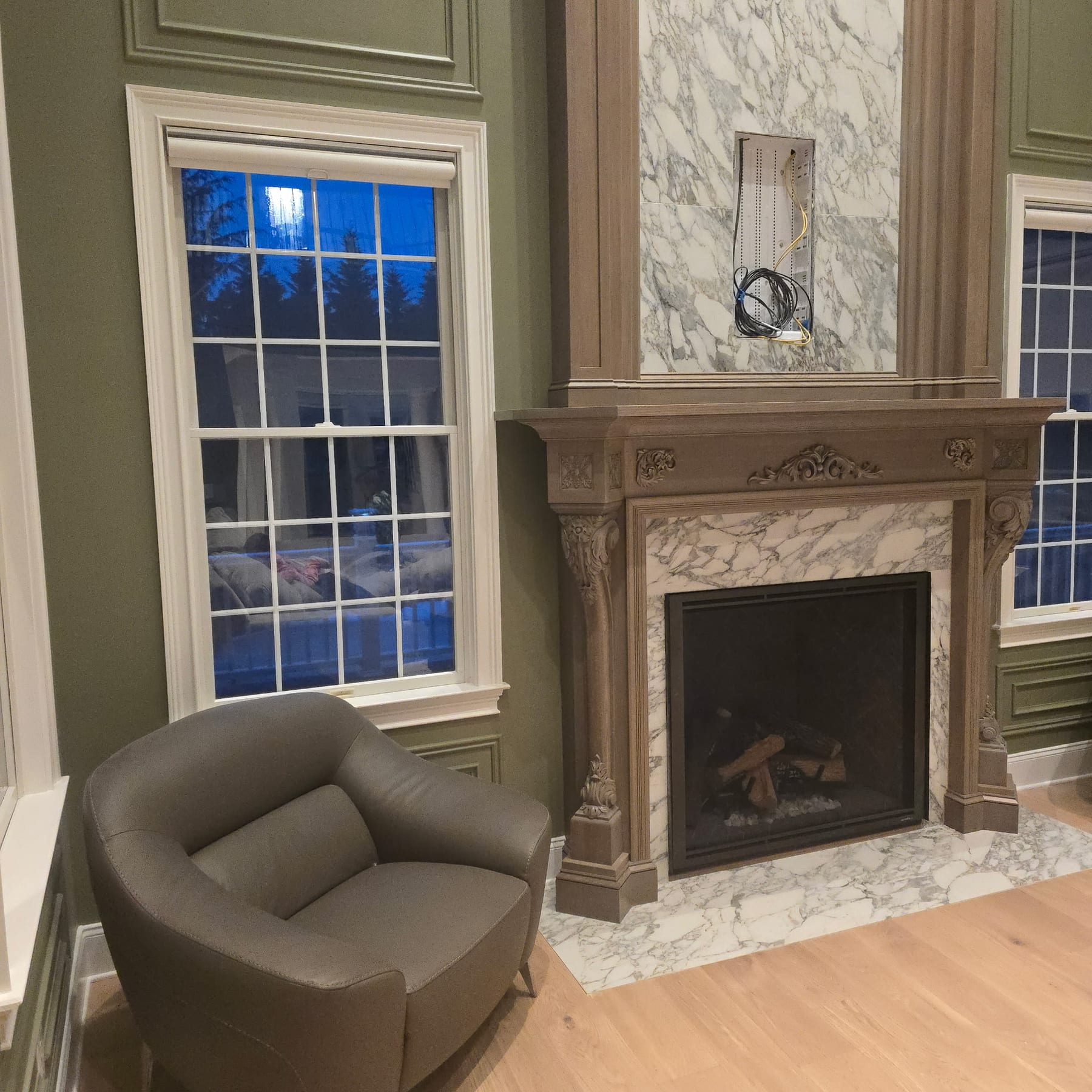Finished family room with custom marble fireplace